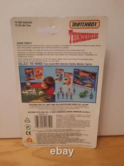 Une figurine John Tracy Thunderbirds vintage extrêmement rare, sur carte neuve, 1992, jamais déballée.